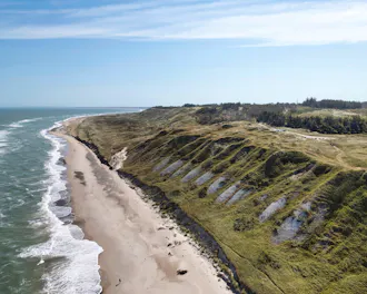 View of the landscape and the sea at Svinkløv Beach